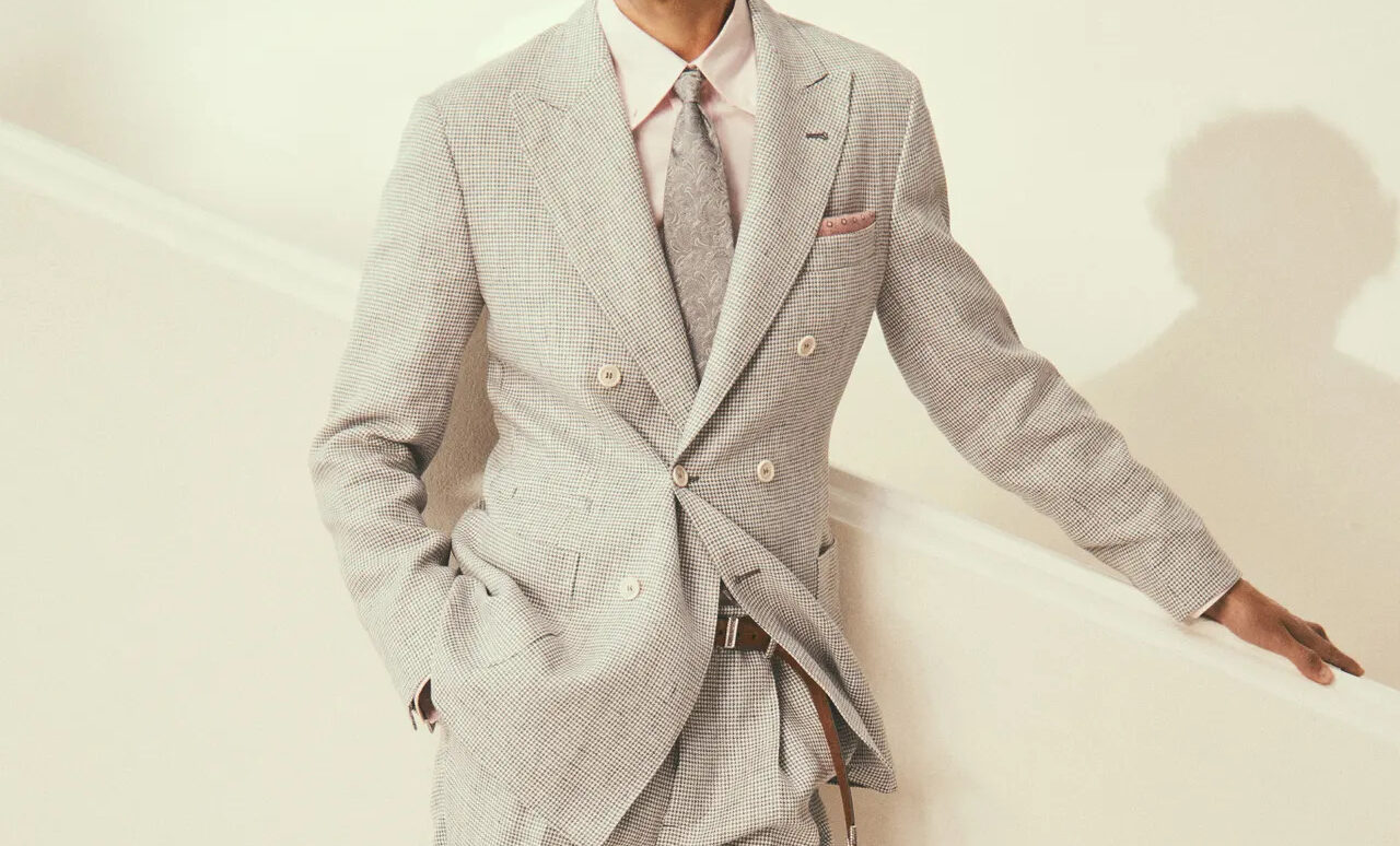 Man dressed in Brunello Cucinelli grey suit with pink shirt on